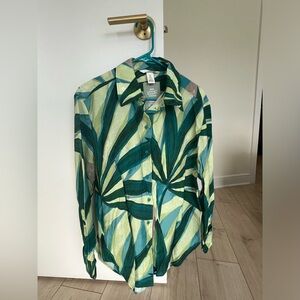 H&M Long-sleeved, lightweight button down. Turquoise and green tropical pattern.